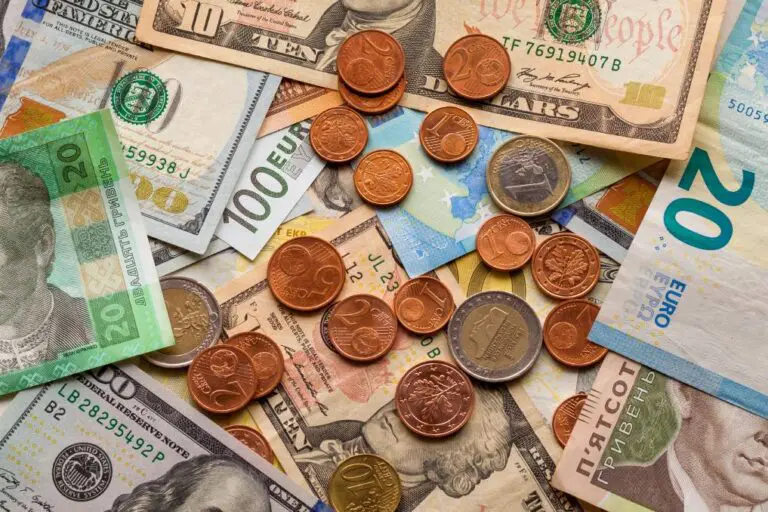 Pile Of Coins And Bank Notes