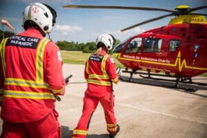 Midlands Air Ambulance Team Walking Towards Helicopter
