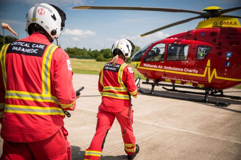 Midlands Air Ambulance Team Walking Towards Helicopter
