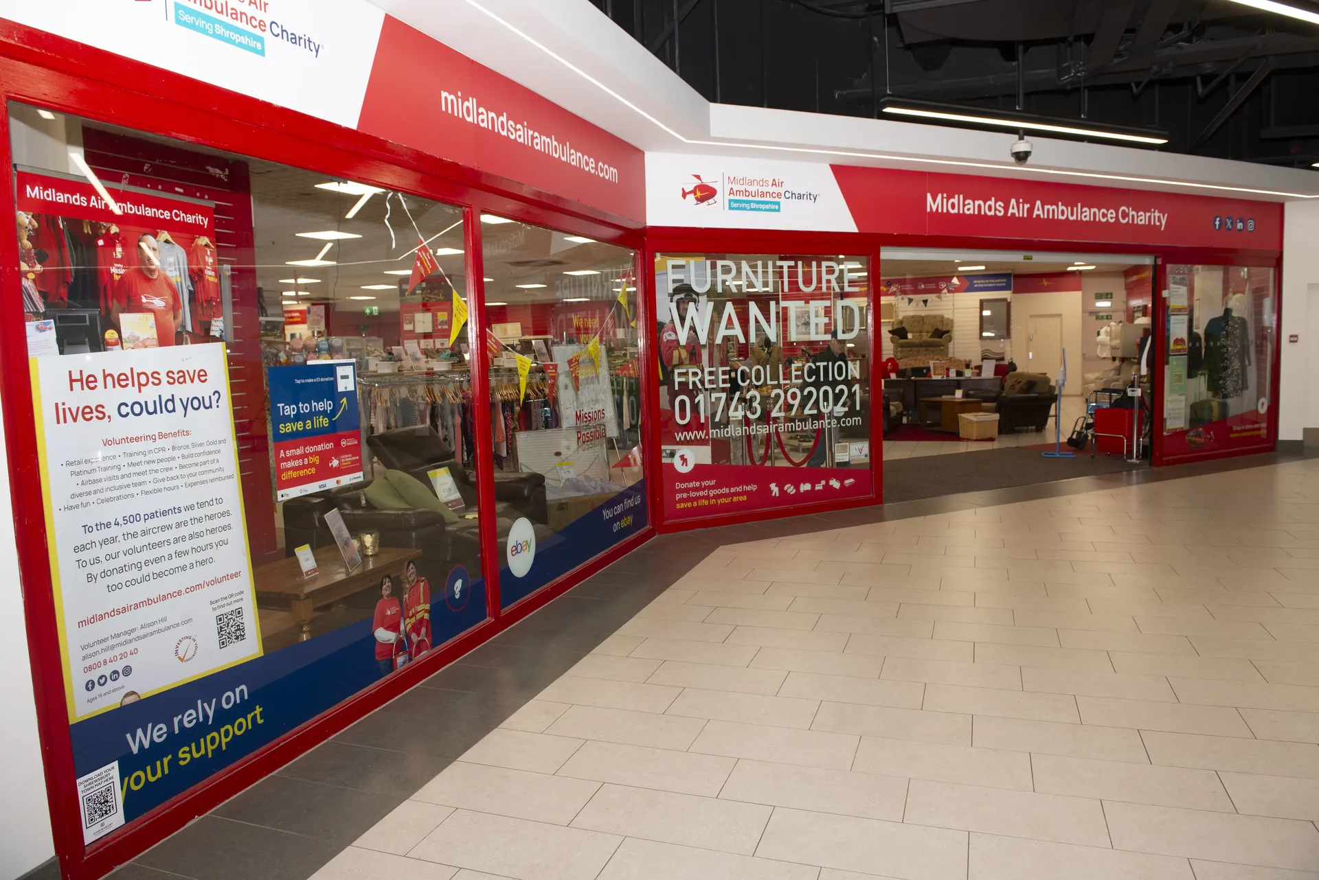 The front of Midlands Air Ambulance charity shop in Shrewsbury, with bright red signage.