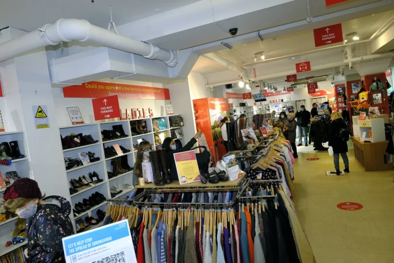 Maac Gloucester Shop With A Lot Of Clothes And People Walking Around