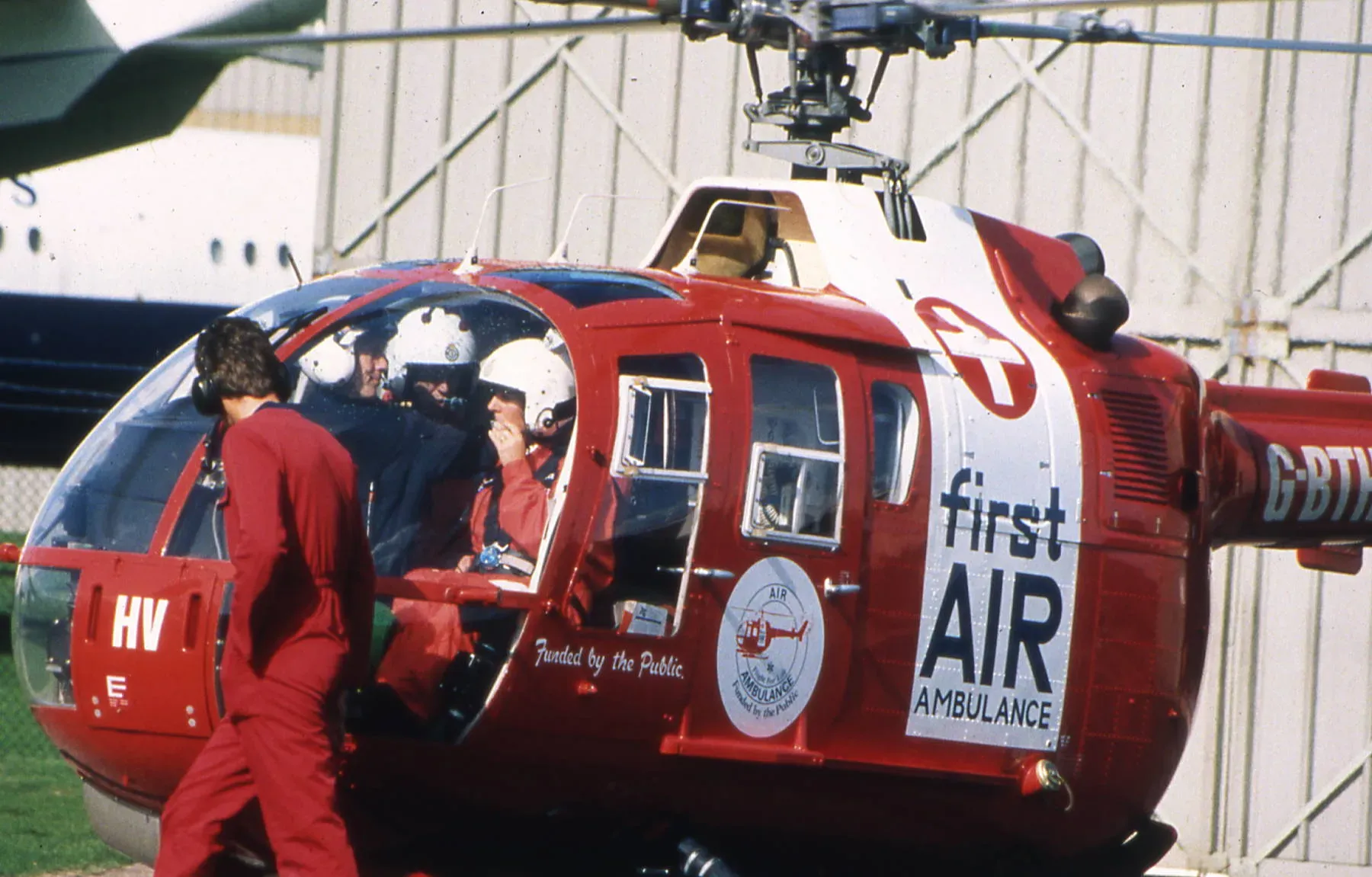 Maac Air Ambulance Helicopter With People Getting Off Of It