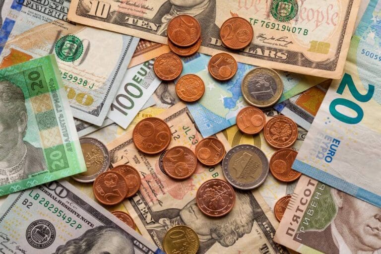 Pile Of Coins And Bank Notes