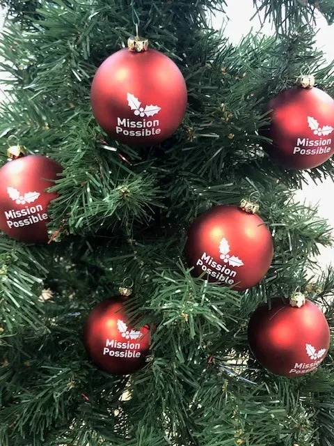 Maac A Close Up Of A Christmas Tree With Red Ornaments On It