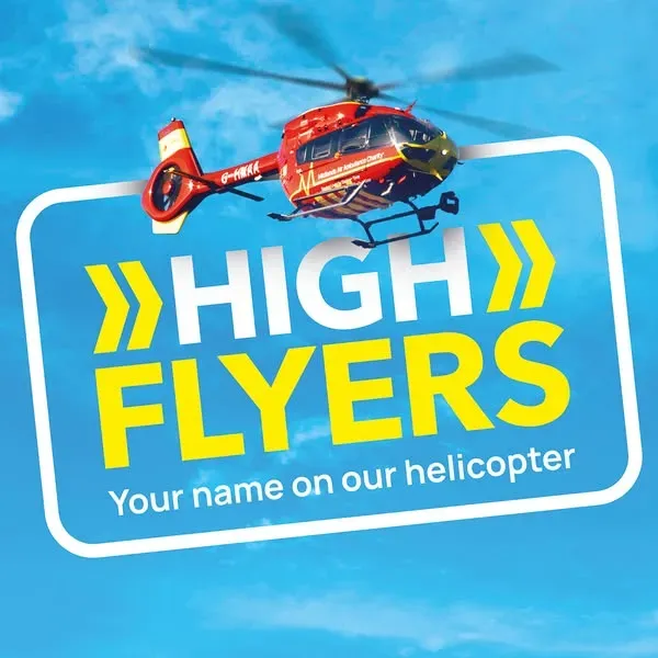 Maac A Close Up Of A Helicopter Flying In The Sky With A Sign