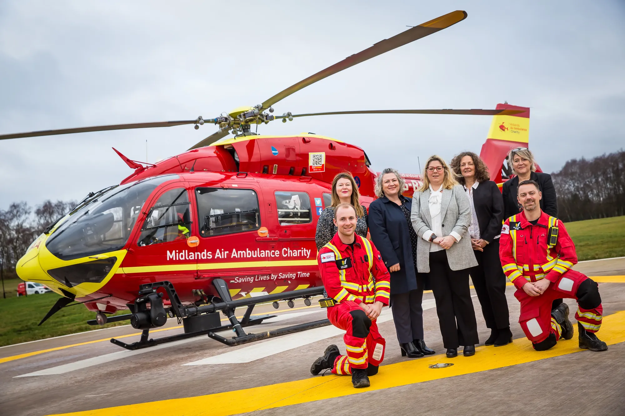 Maac Air Ambulance Crew Posing For A Picture With A Helicopter