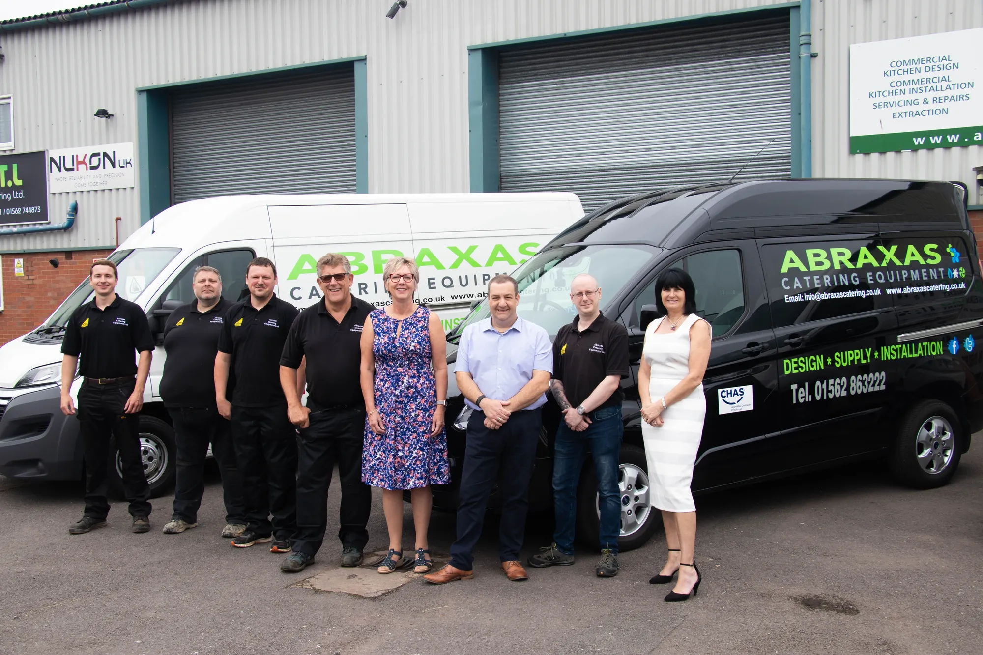 Maac Arafaxs Group Of People Standing In Front Of A Van