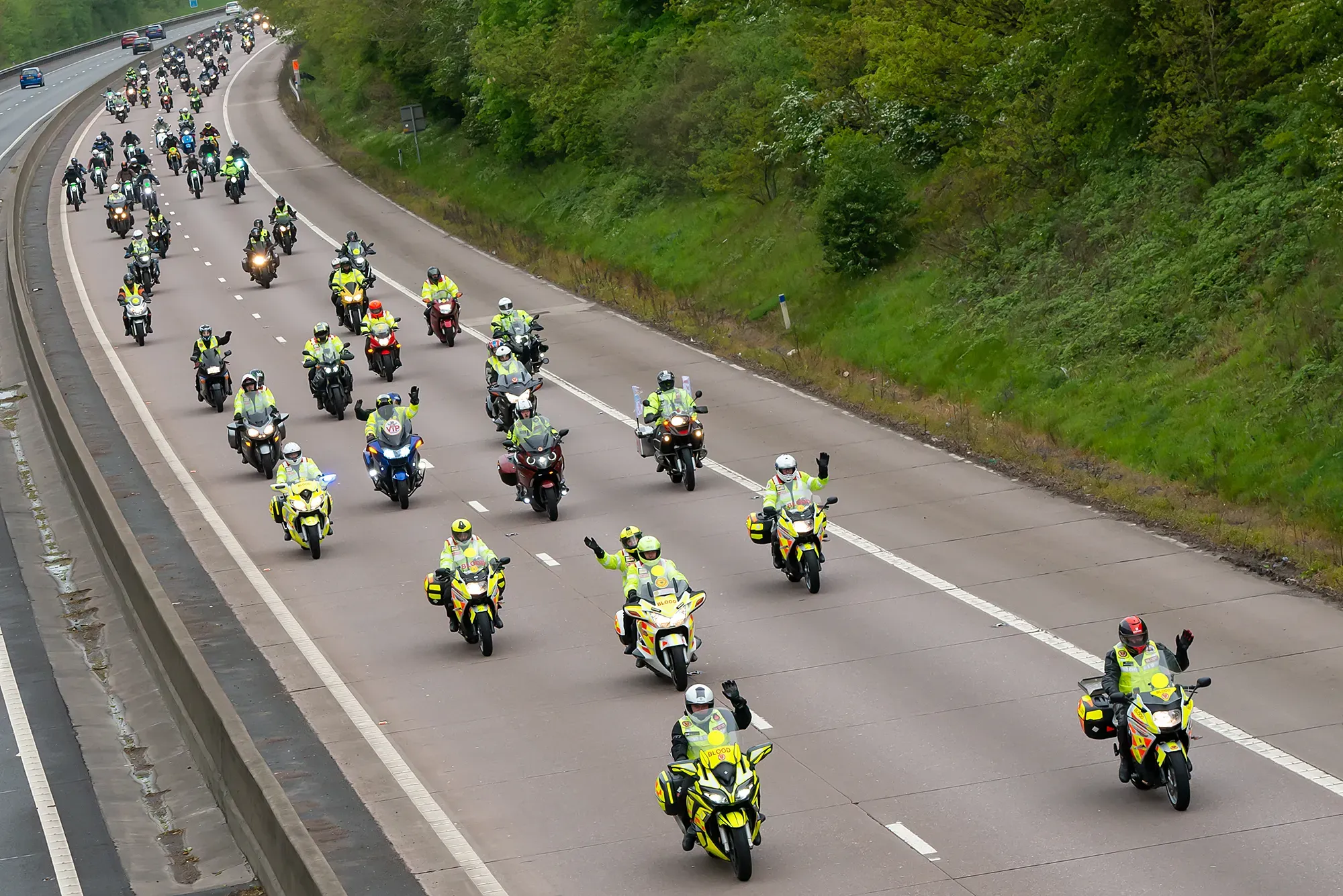 Maac Araffes Of Motorcycles Are Riding Down The Highway With Police Officers