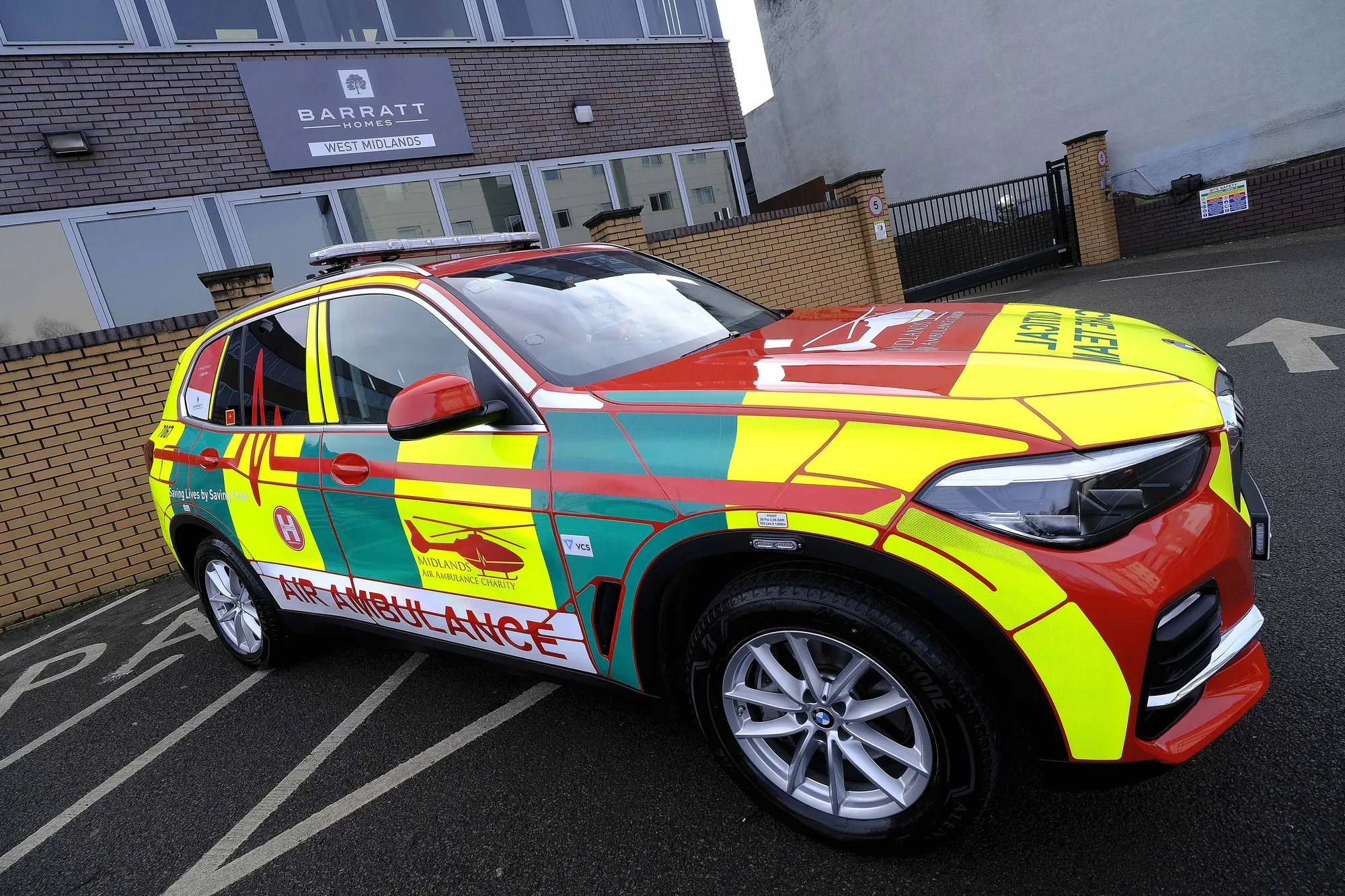 Maac Car With A Painted Side Panel In A Parking Lot