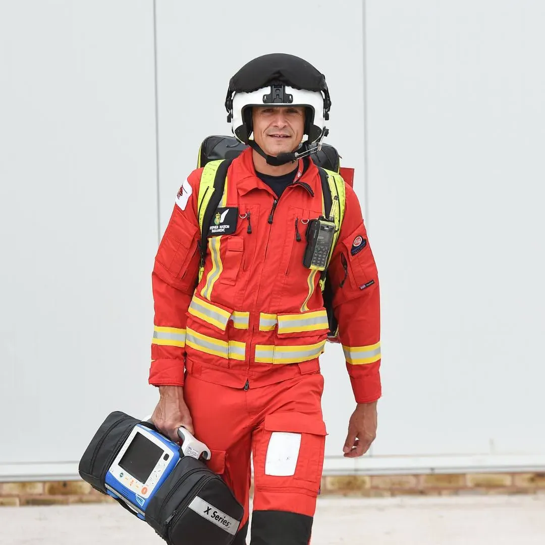 Maac Firefighter Walking With A Suitcase And Helmet