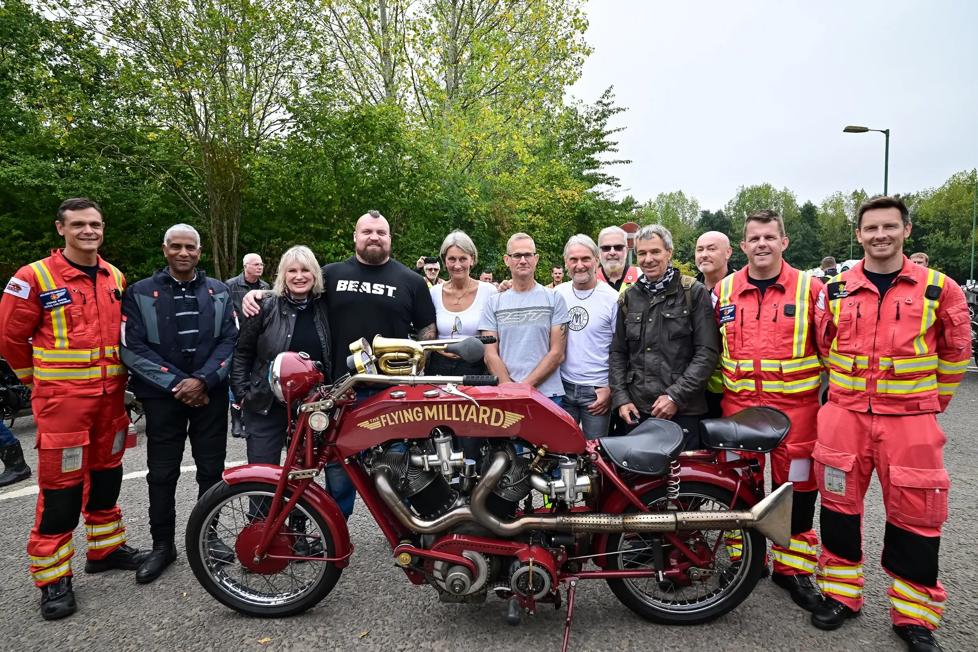 Maac Firefighters And Firemen Posing With A Motorcycle In A Parking Lot