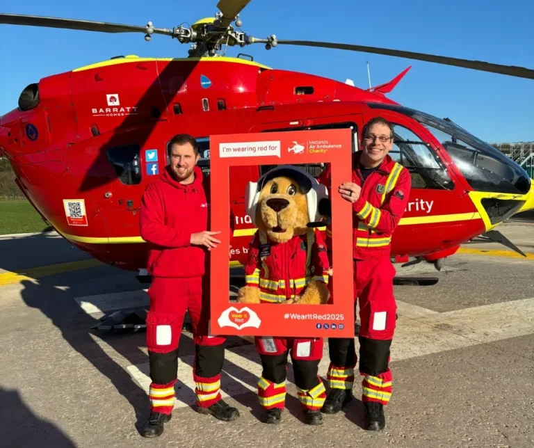 Maac Firefighters Posing With A Red Helicopter And A Mascot