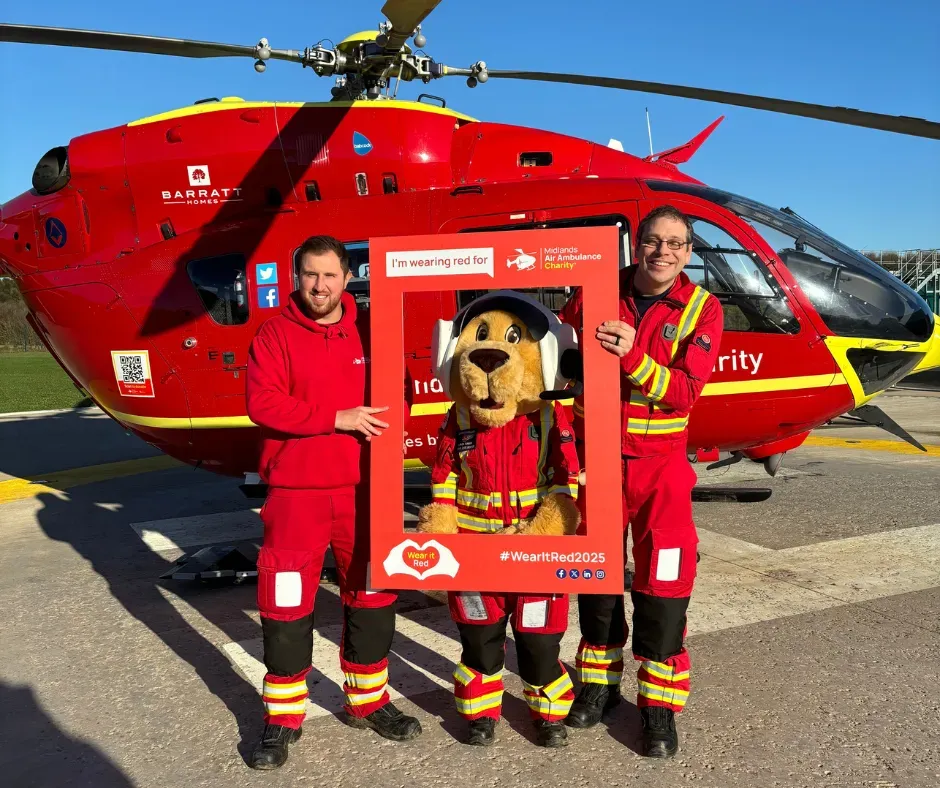 Maac Firefighters Posing With A Red Helicopter And A Mascot