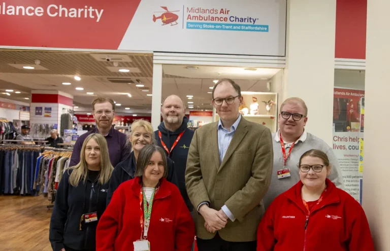 Maac Group Of People Standing In Front Of A Clothing Store