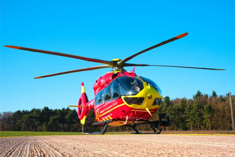 Maac Helicopter On The Ground With A Plowed Field In The Background