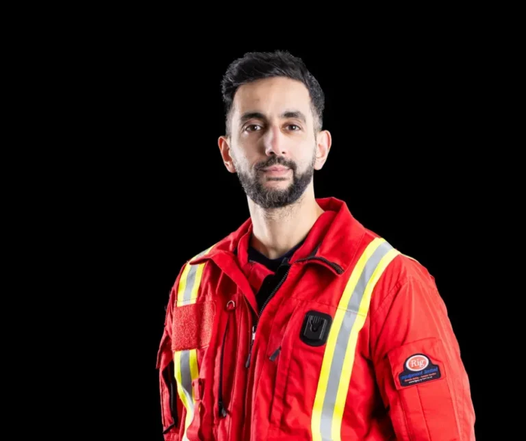 Maac Man In A Red Jacket And Reflective Vest Posing For A Picture