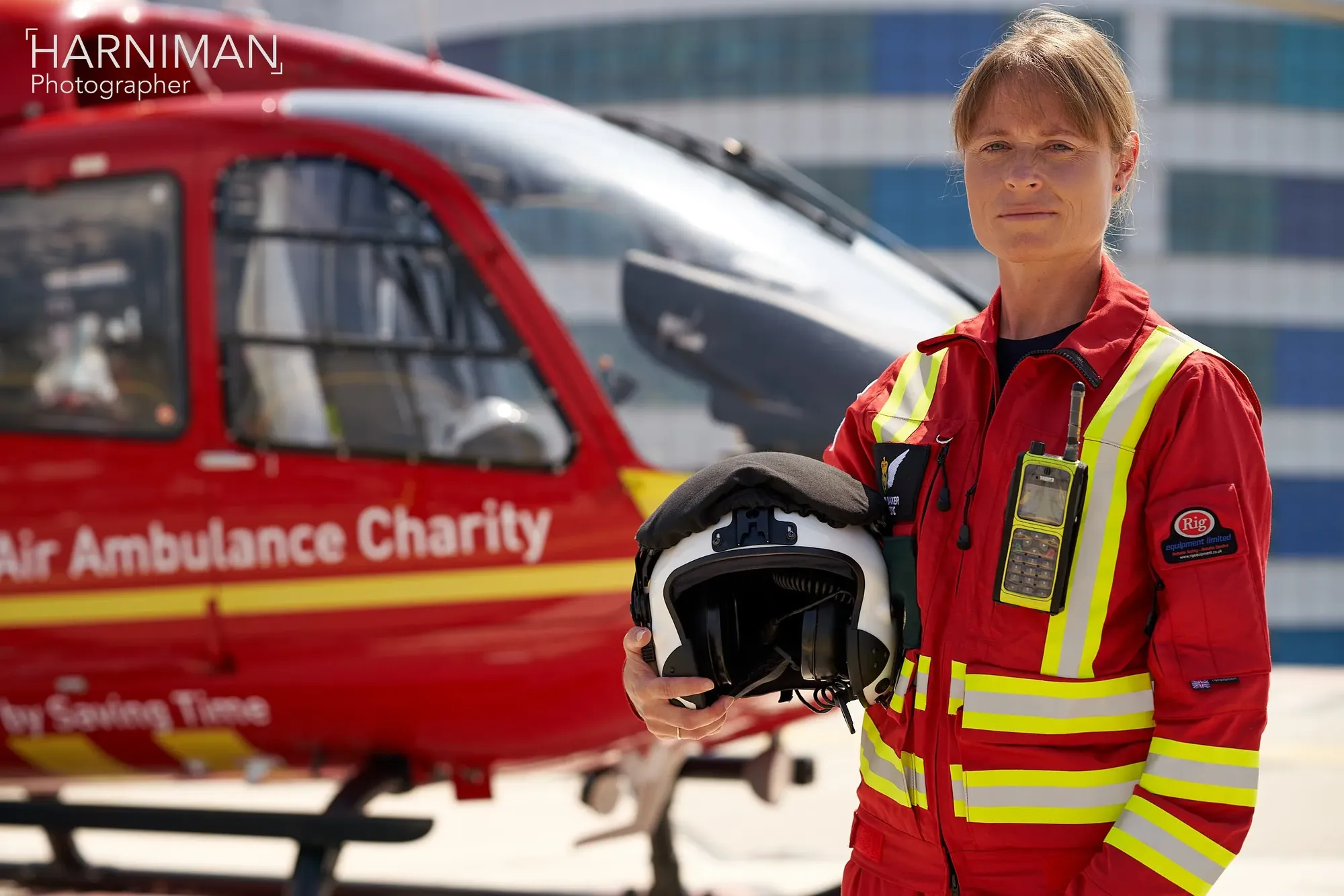 Maac Man In Red Uniform Holding Helmet And Helmet In Front Of Helicopter