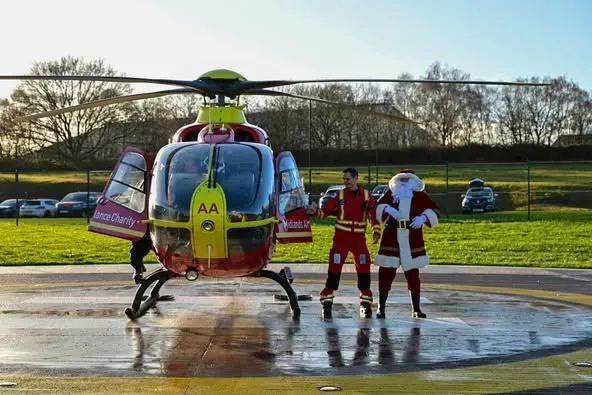 Maac Man In Santa Claus Costume Getting Off Of A Helicopter