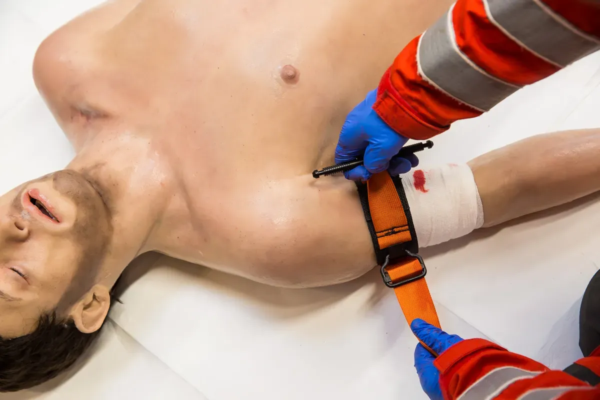 Maac Man With A Bandaged Arm Is Being Examined By A Doctor