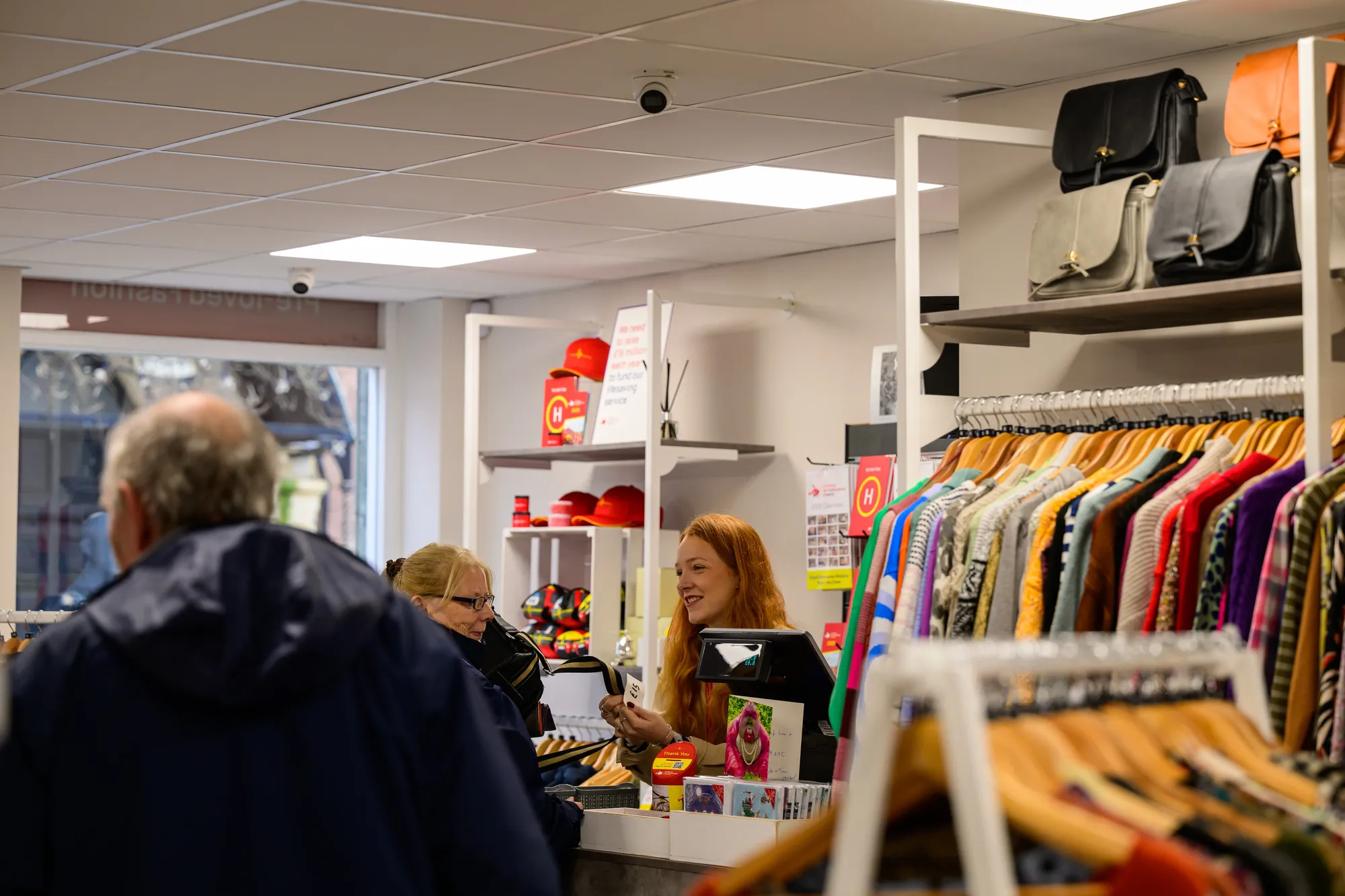 Maac People Are Shopping In A Clothing Store With A Man And Woman