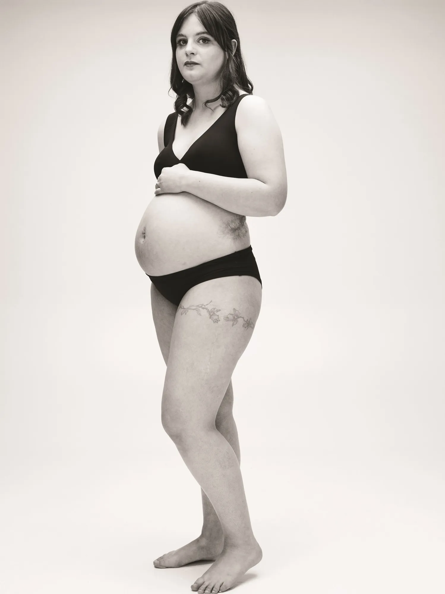 Maac Pregnant Woman In Black And White Photo With Tattoo On Her Belly