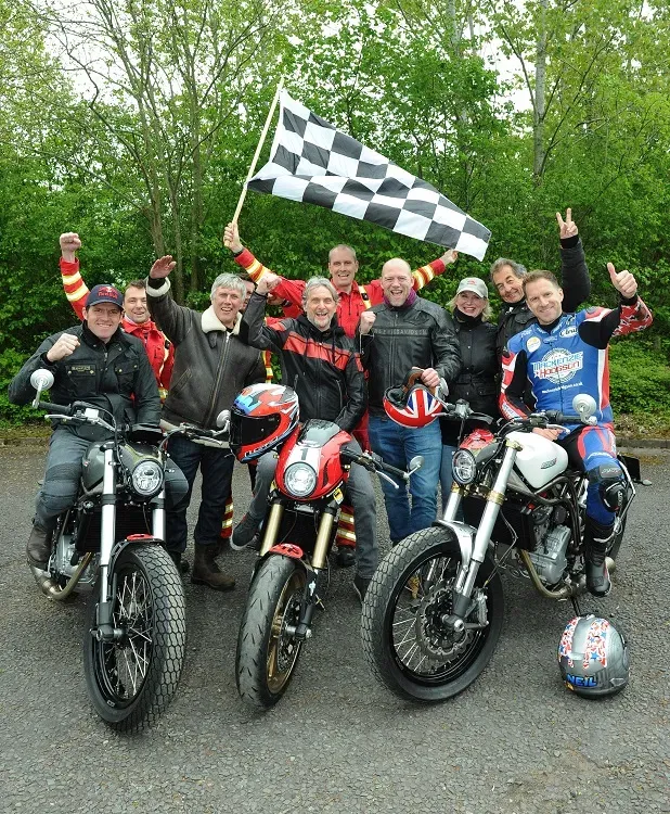 Maac Several People Are Posing For A Picture With Their Motorcycles