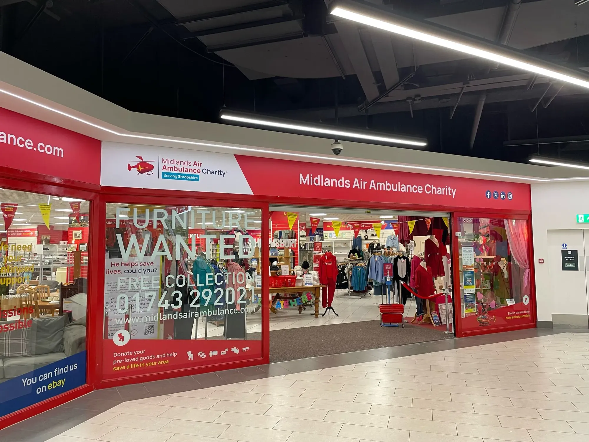 Maac Store With A Red Door And A Sign That Says United Airlines