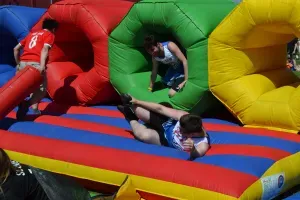 Maac There Are Many People Playing In A Giant Inflatable Obstacle
