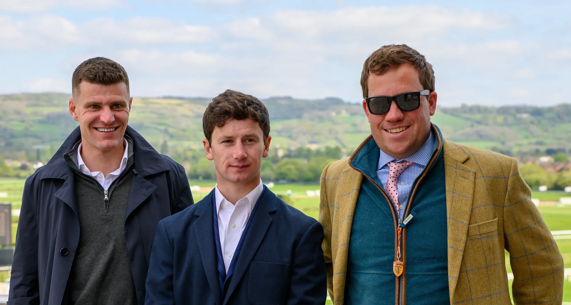 Maac There Are Three Men Standing Next To Each Other In A Field