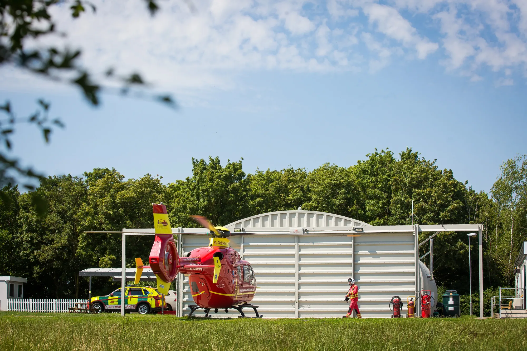 Maac There Is A Helicopter That Is Sitting In The Grass