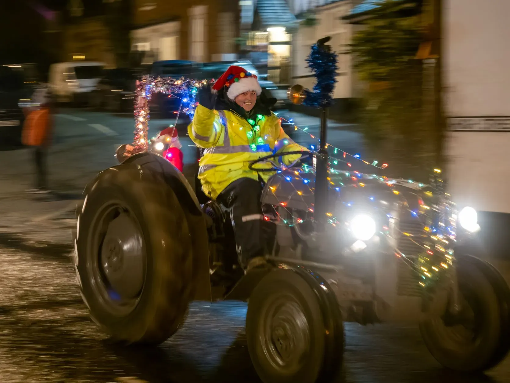 Maac There Is A Man Riding A Tractor With A Christmas Hat On