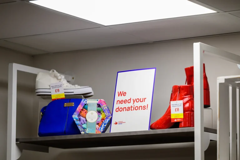 Maac There Is A Shelf With A Sign And A Pair Of Shoes On It
