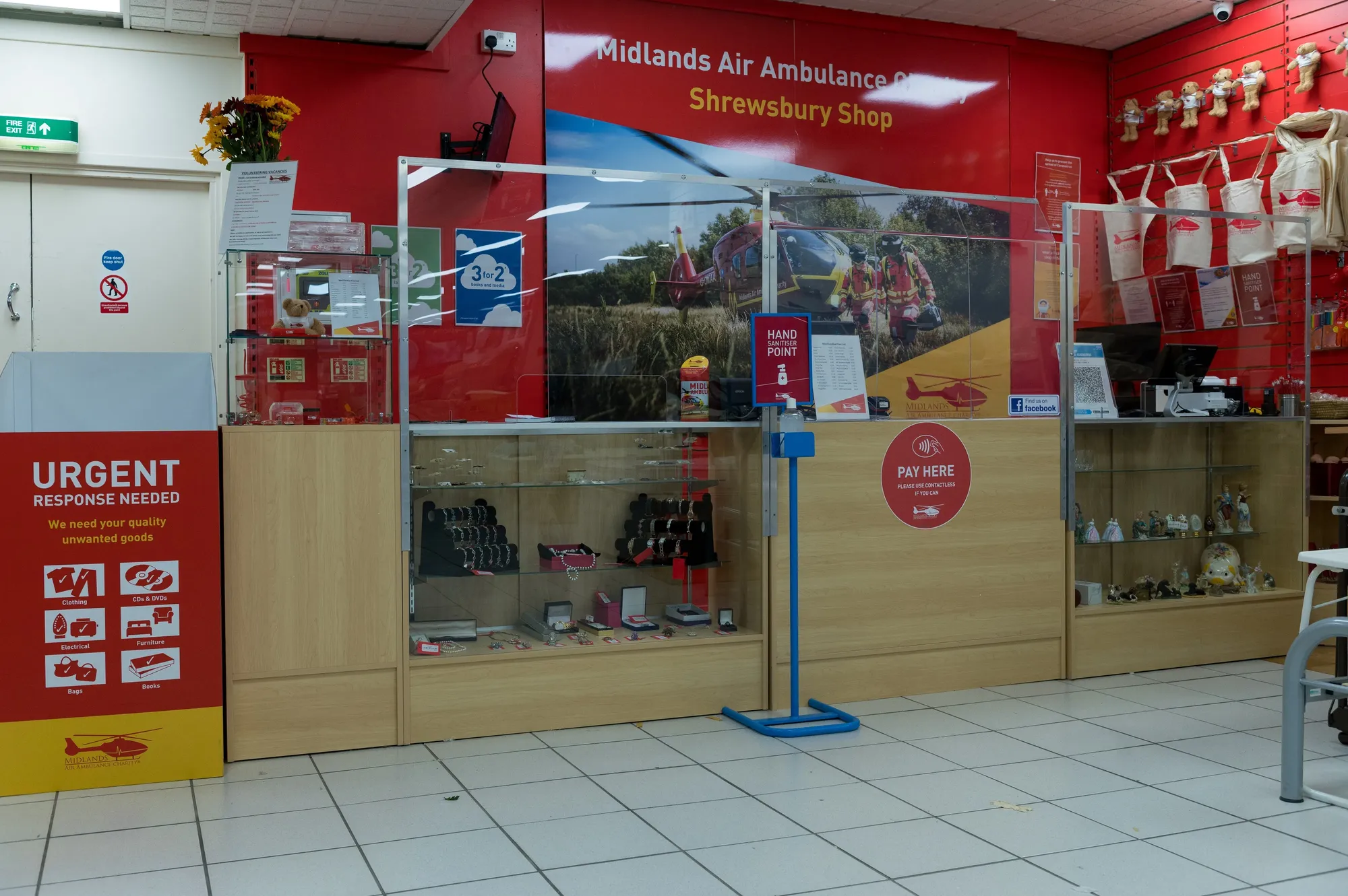 Maac There Is A Store With A Display Case And A Sign In The Window