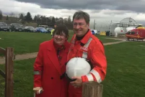 Maac They Are Standing In A Field With A Ball And A Helicopter