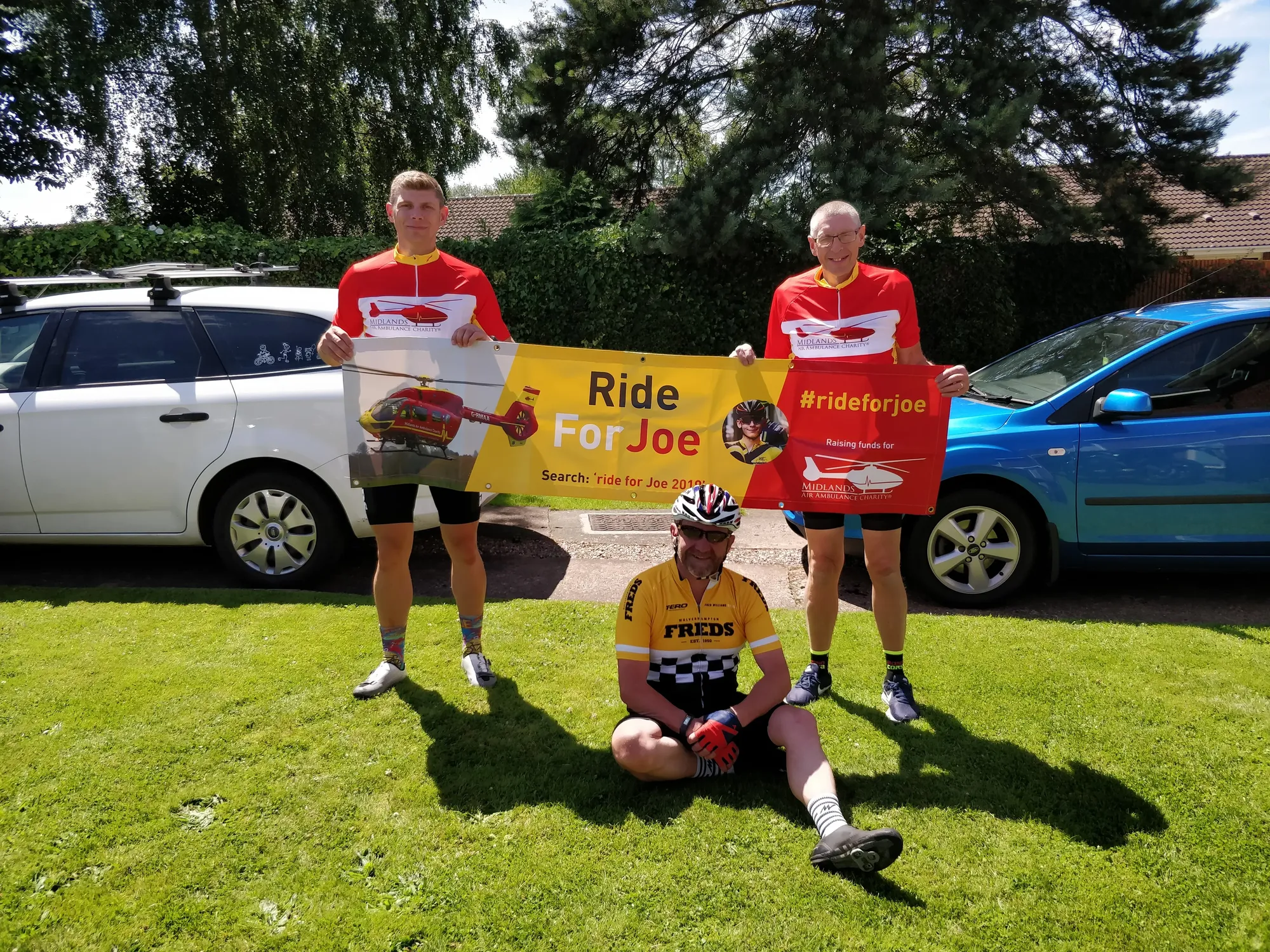Maac Three Men In Red Shirts And Yellow Shorts Are Posing For A Picture