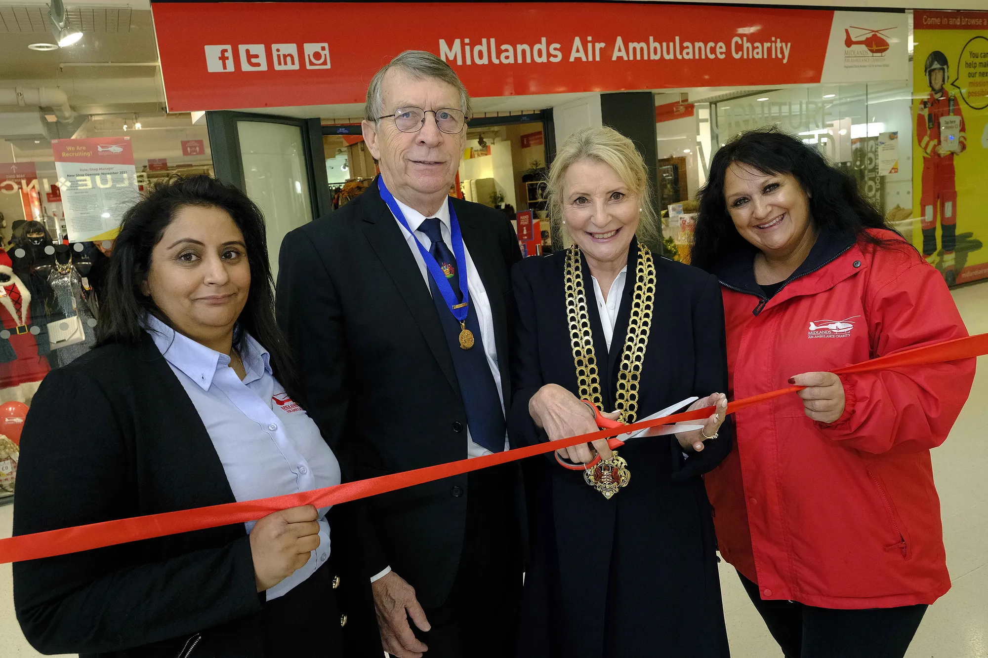 Maac Three People Are Holding A Ribbon And Posing For A Picture