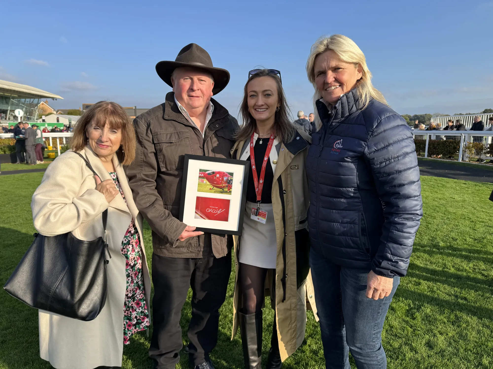 Maac Three People Standing Next To Each Other Holding A Plaque