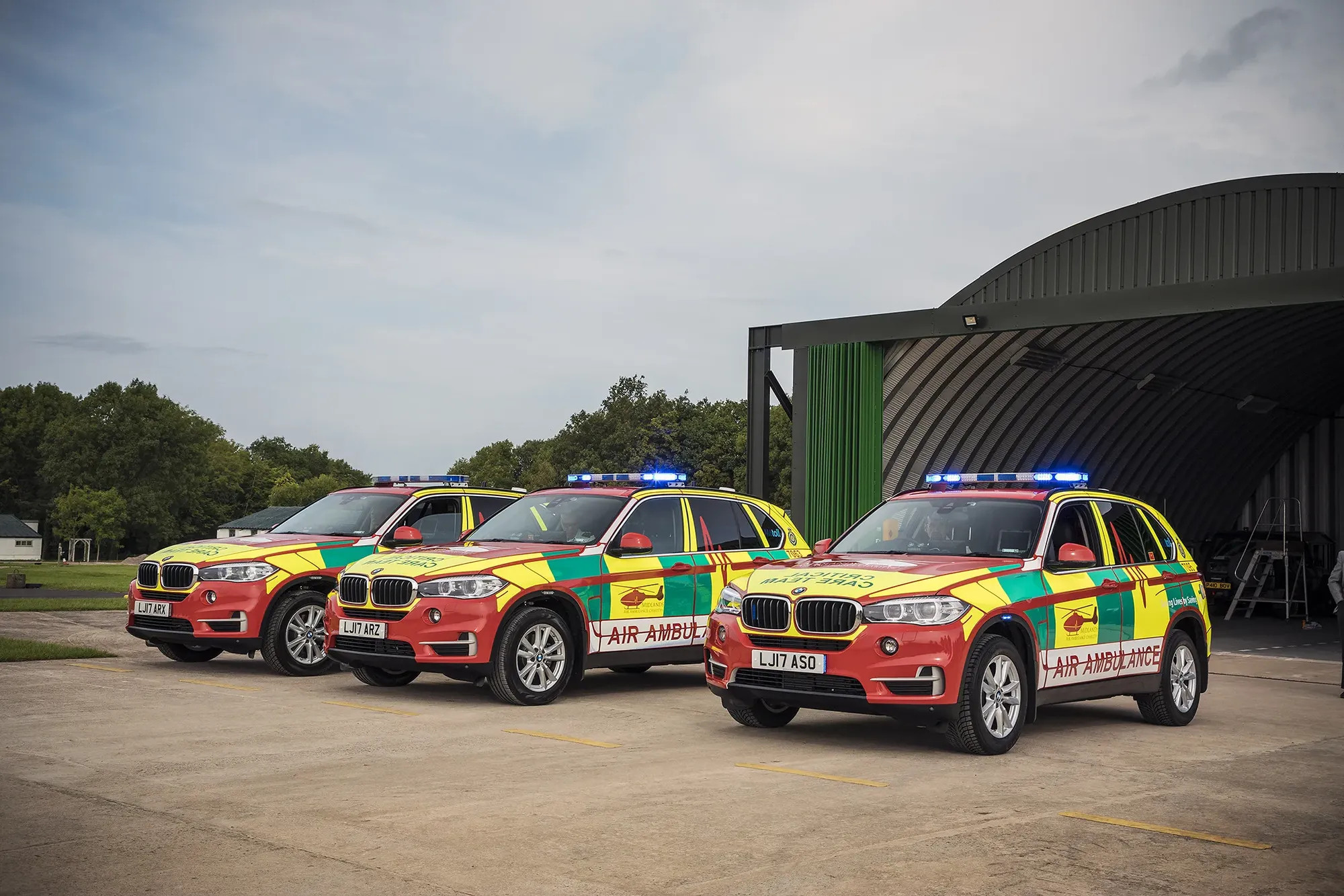 Maac Three Police Cars Are Parked In A Parking Lot With A Building In The Background