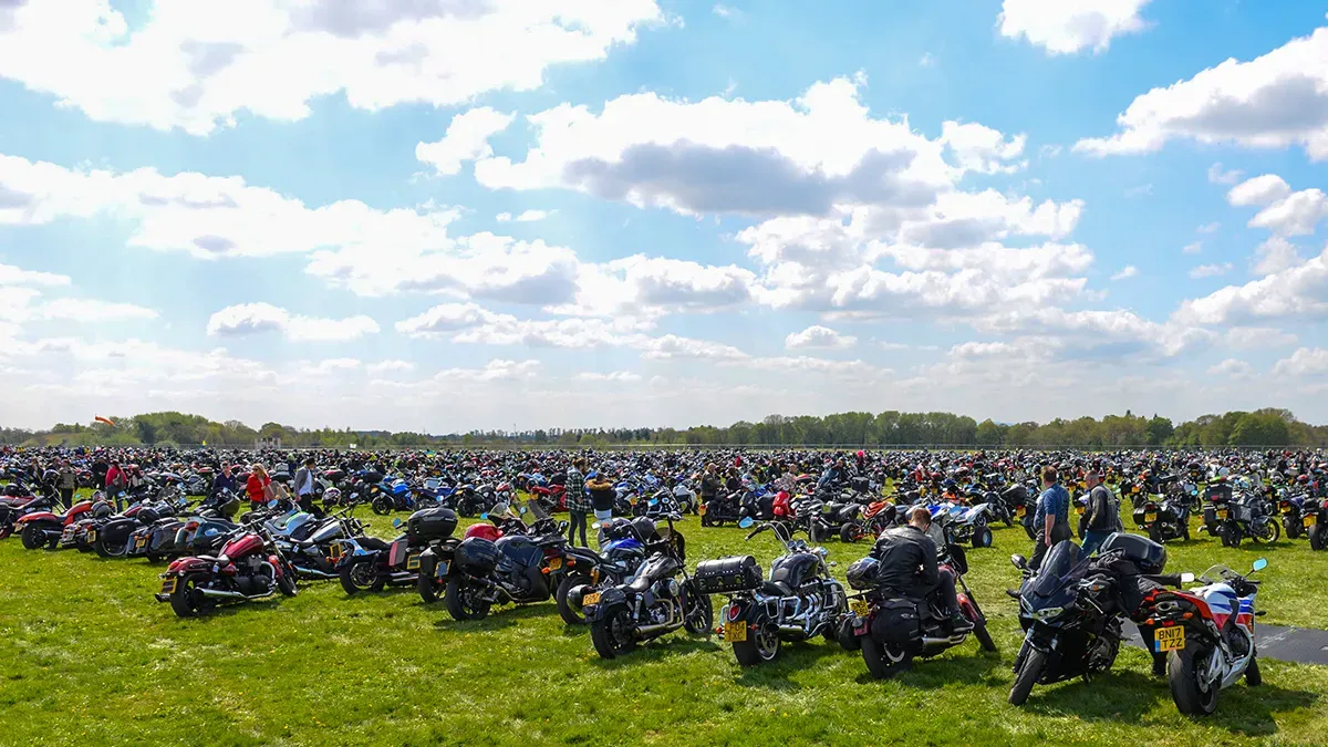 Maac View Of A Large Group Of Motorcycles Parked In A Field