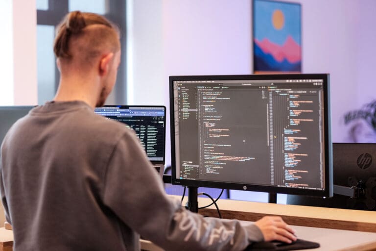 Web developer writing code