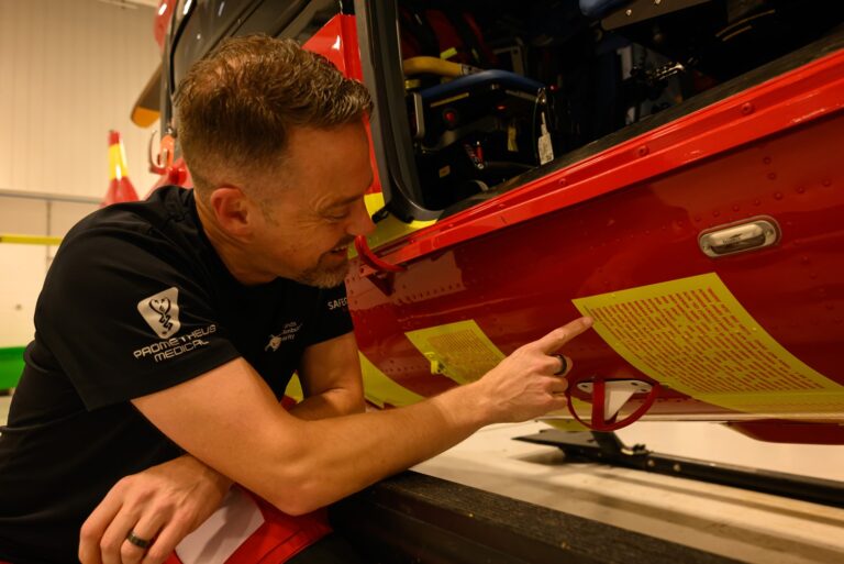 Dr Jon Bingham with the names on the helicopter